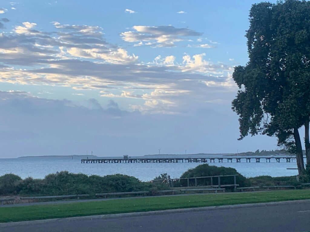 long view of beach and jetty